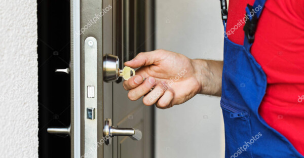 repairman working with house door lock