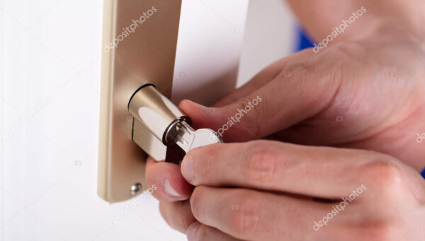 carpenter inserting key in keyhole