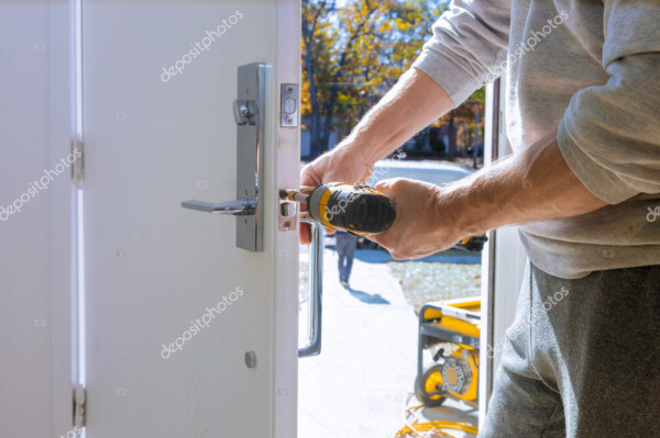 builder in installing a door lock the door of a new house
