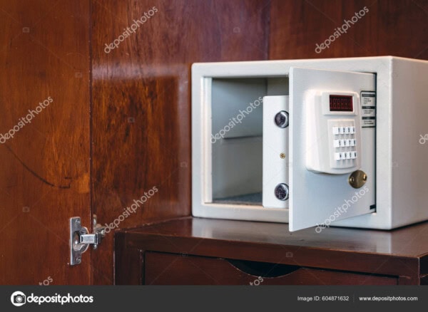security open metal safe with empty space inside in a wooden she