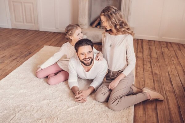 happy young family with one child spending time together at home